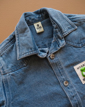 Blue long-sleeve collared baby shirt with button closure and chest pockets