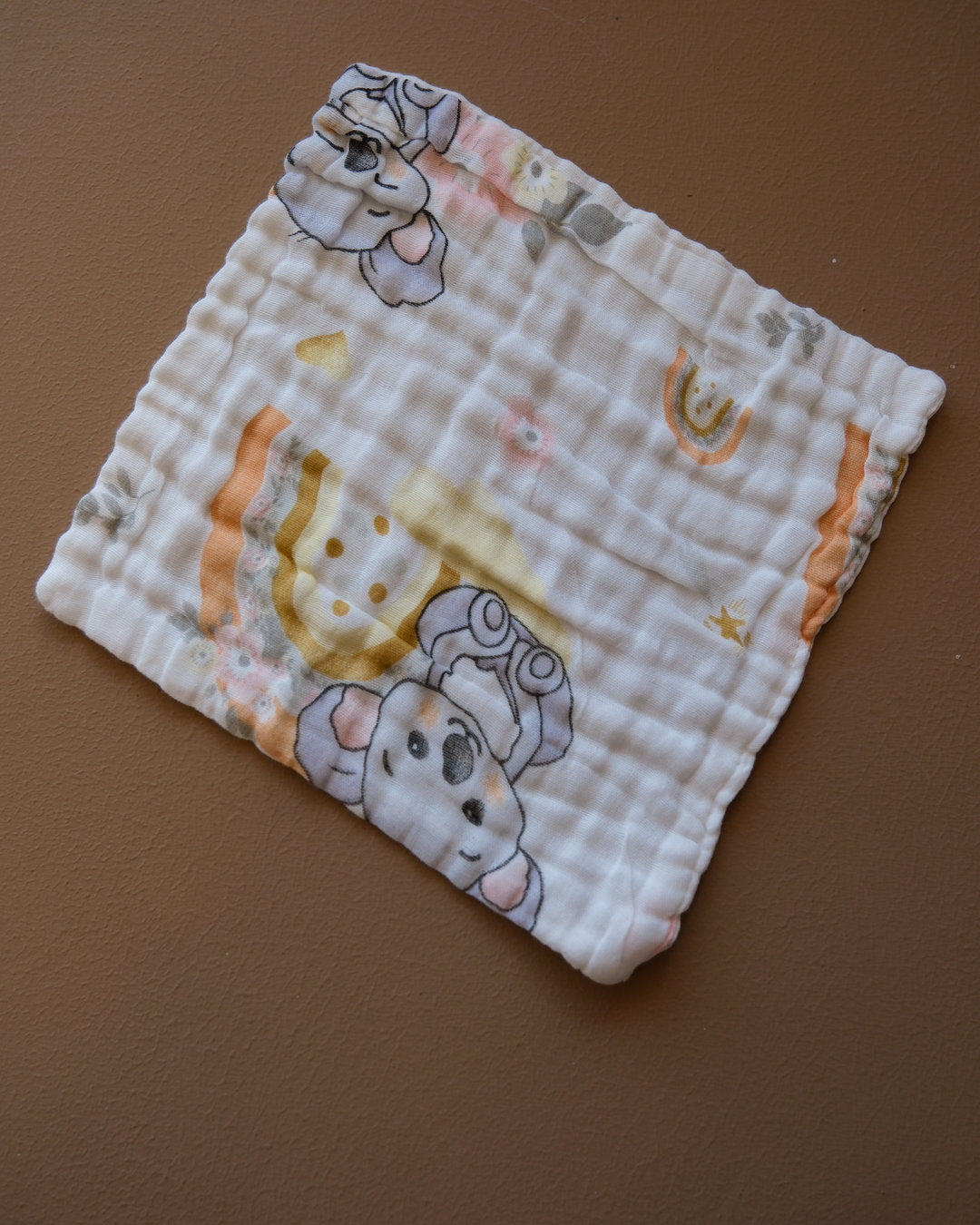 Six-layer white muslin baby face towel with assorted colorful printed designs