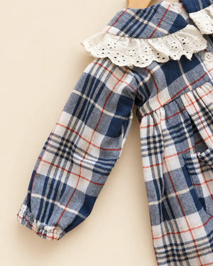 Navy blue plaid girls' frock with eyelet lace collar, long sleeves, buttons, and front pockets