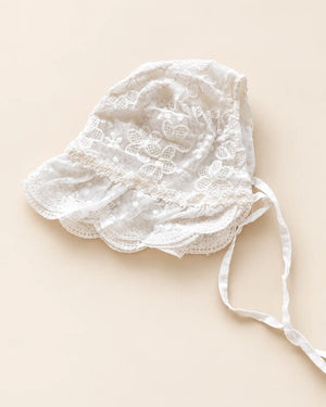 Delicate floral lace baby bonnet with tie straps