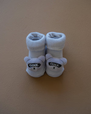 Assorted pastel baby socks with embroidered animal faces