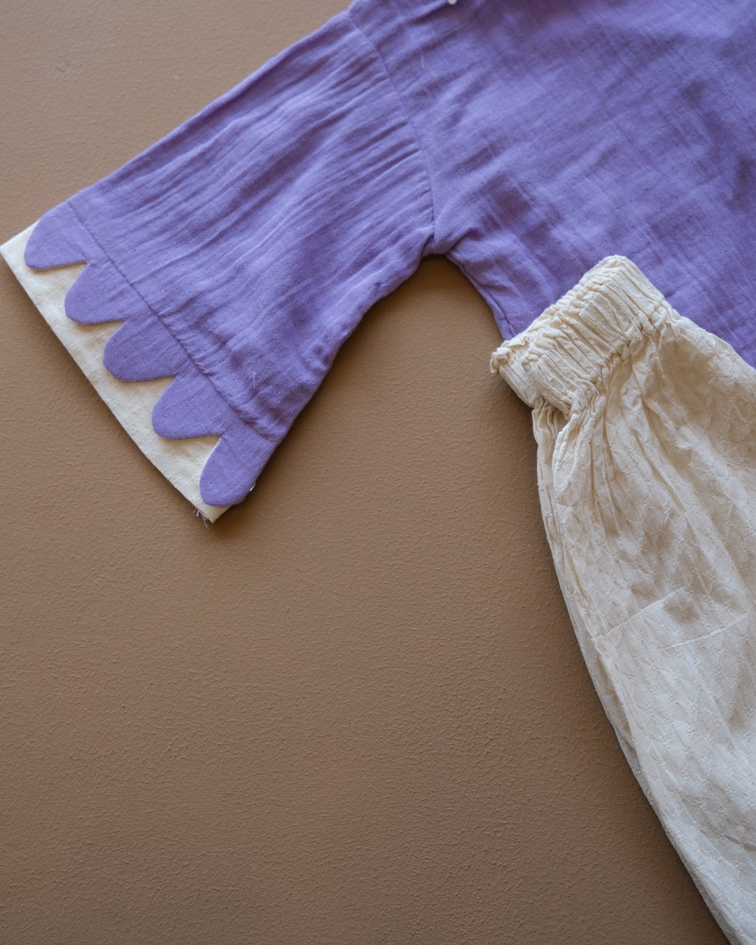 Girls' purple floral-trim top with coordinating off-white pants