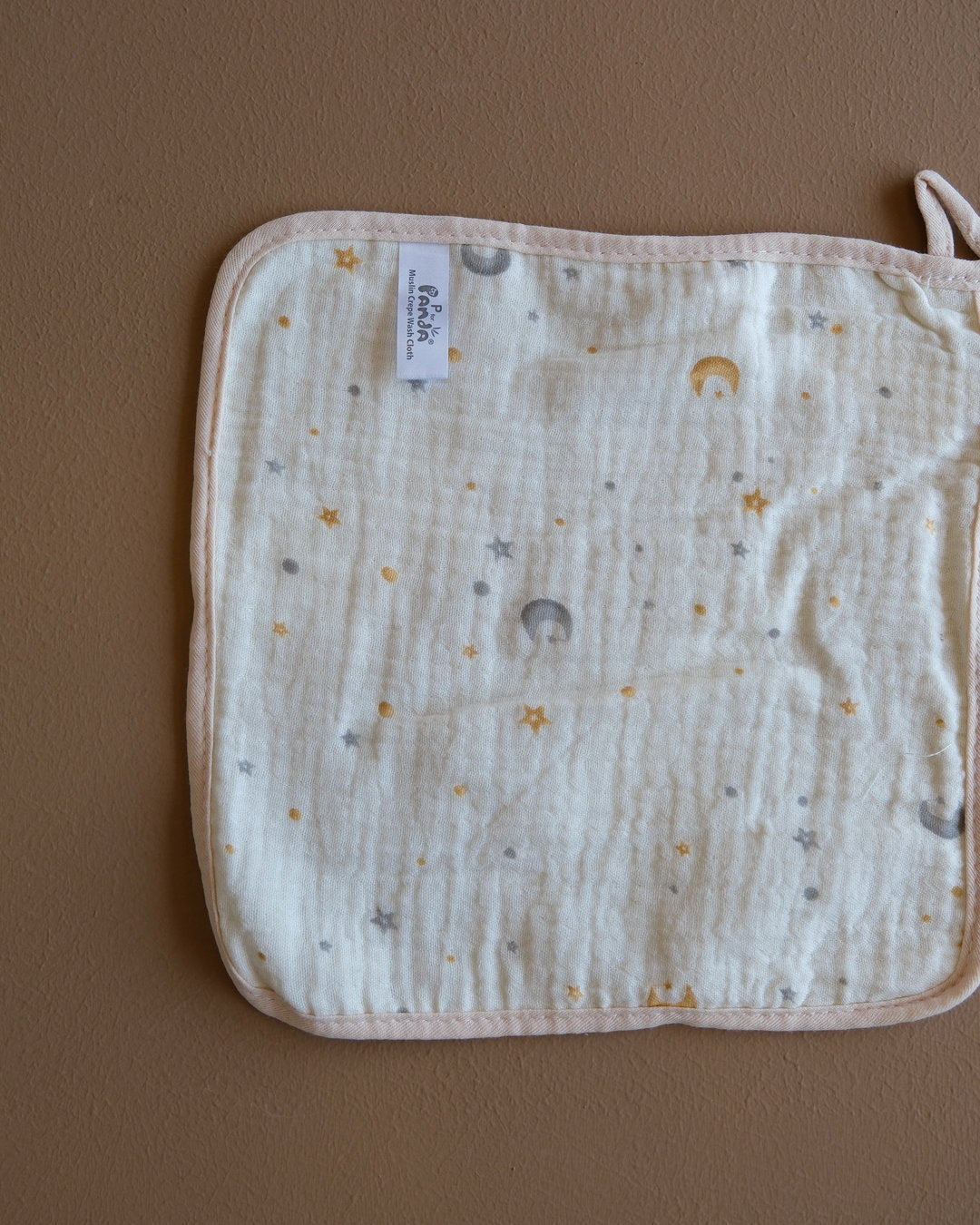 Assorted printed baby washcloths with colorful animal, floral, rainbow, and playful designs