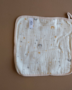Assorted printed baby washcloths with colorful animal, floral, rainbow, and playful designs