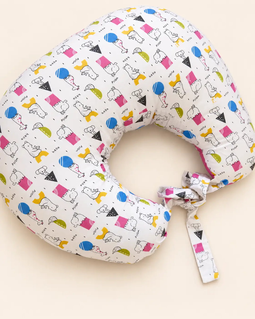 White U-shaped baby nursing pillow with colorful cartoon animal print