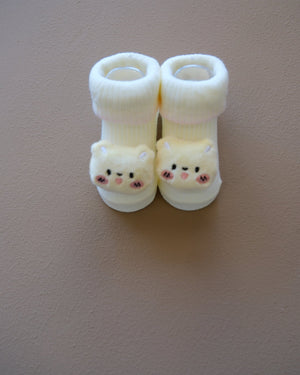 Assorted pastel baby socks with embroidered animal faces