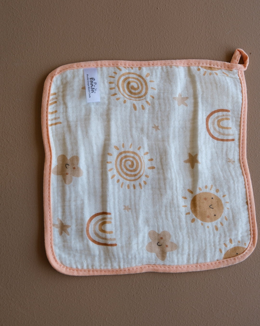 Assorted printed baby washcloths with colorful animal, floral, rainbow, and playful designs