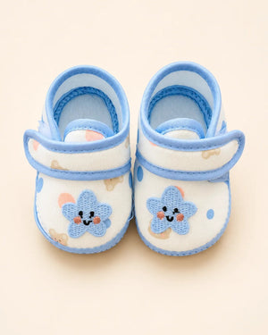 Baby booties with star applique, bear print, and pastel trim