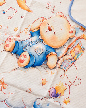 Printed white baby dry sheet with quilted texture and playful nursery illustrations