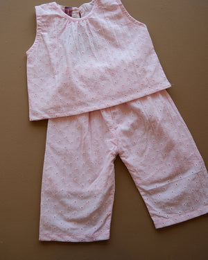 Soft pink sleeveless floral eyelet jumpsuit with wide-leg pants