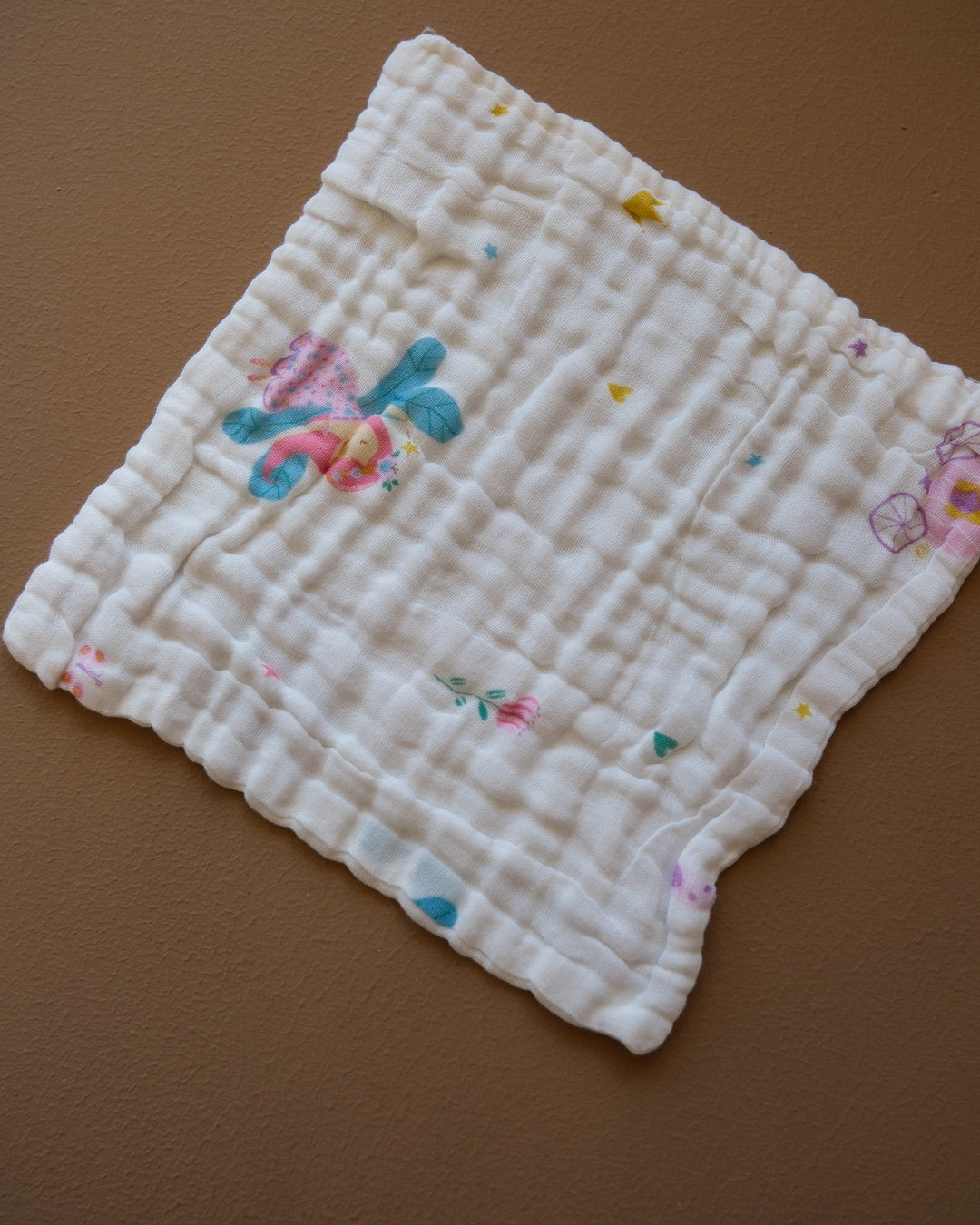 Six-layer white muslin baby face towel with assorted colorful printed designs