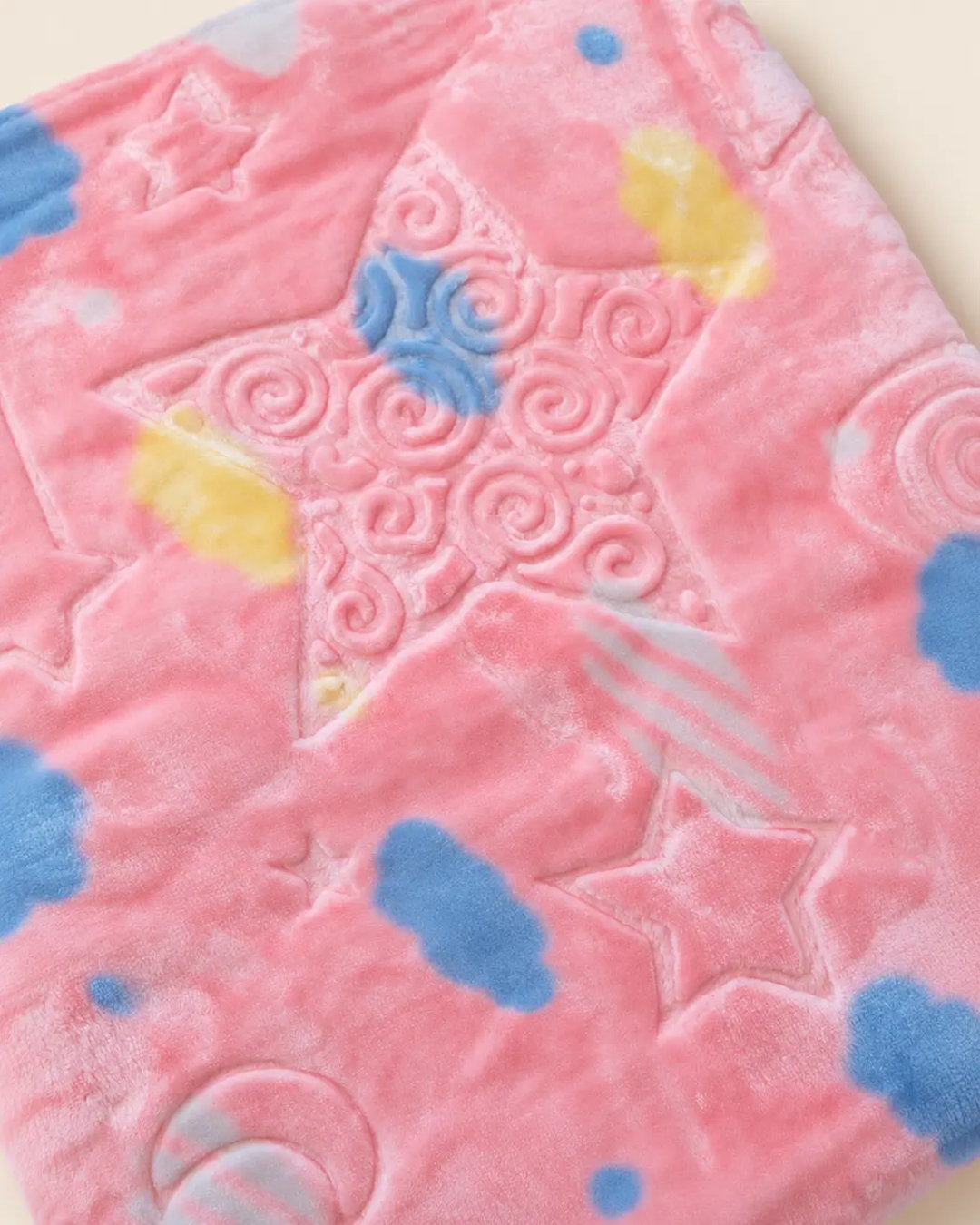 Blue and pink baby blanket with star, moon and cloud patterns