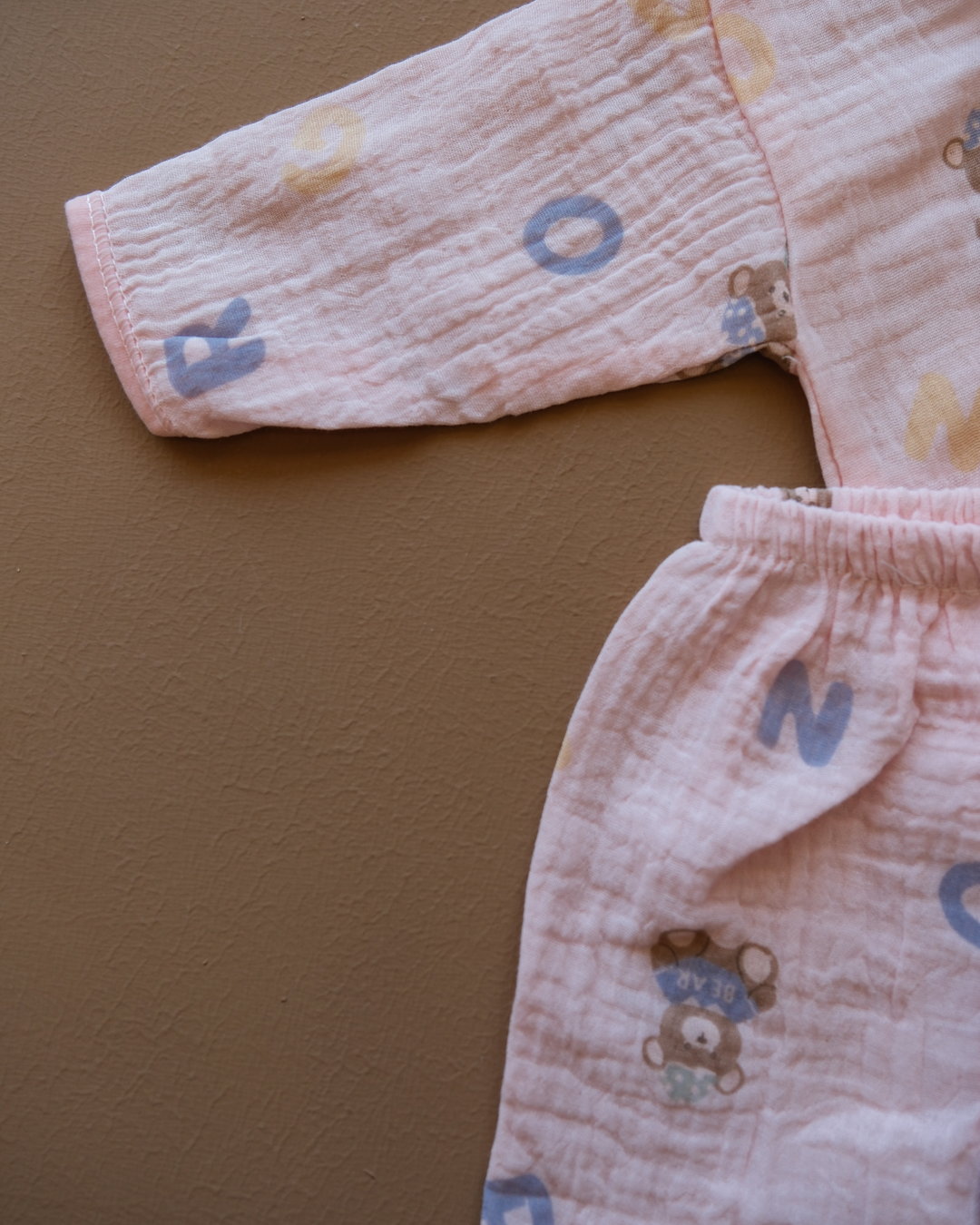 Pale blue baby clothing set with bear and letter prints