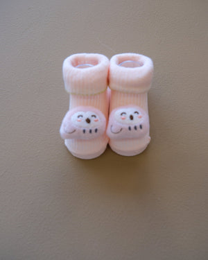 Assorted pastel baby socks with embroidered animal faces
