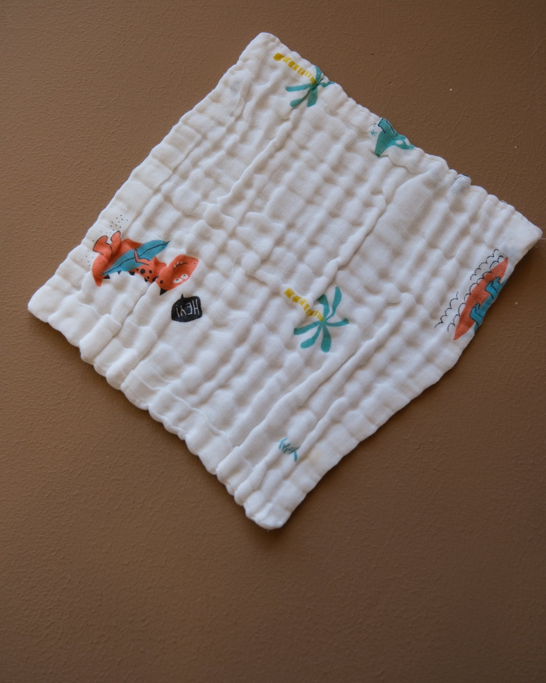 Six-layer white muslin baby face towel with assorted colorful printed designs