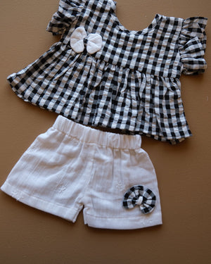 Black and white gingham girls frock set with bow detail and matching white shorts