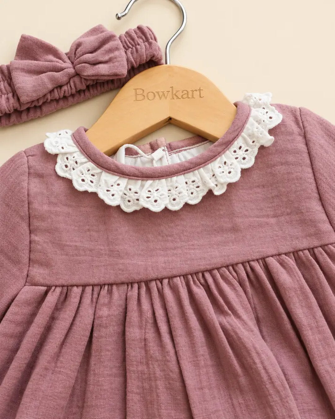 Dusty mauve baby girls' frock set with lace collar, matching bloomers, and bow headband