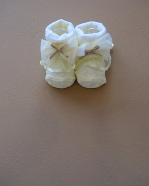 Newborn baby socks with decorative bows in pastel colors