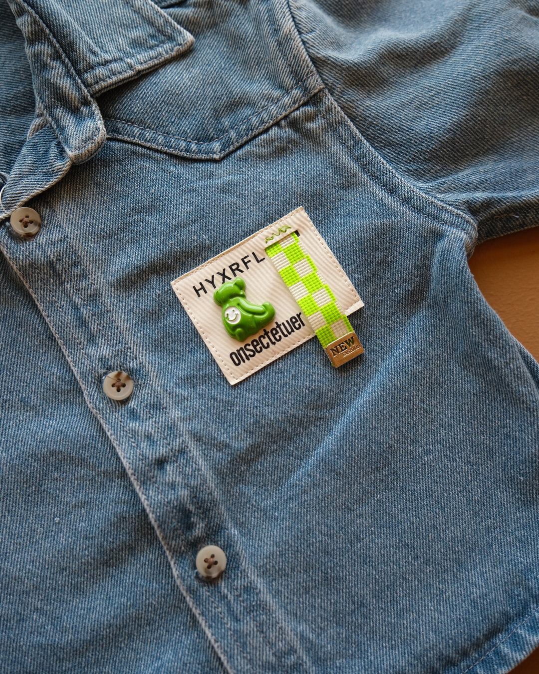 Blue long-sleeve collared baby shirt with button closure and chest pockets