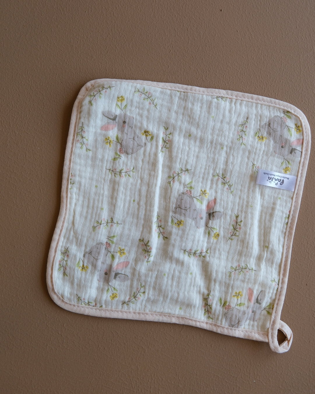 Muslin crepe baby washcloth with pastel animal and heart prints